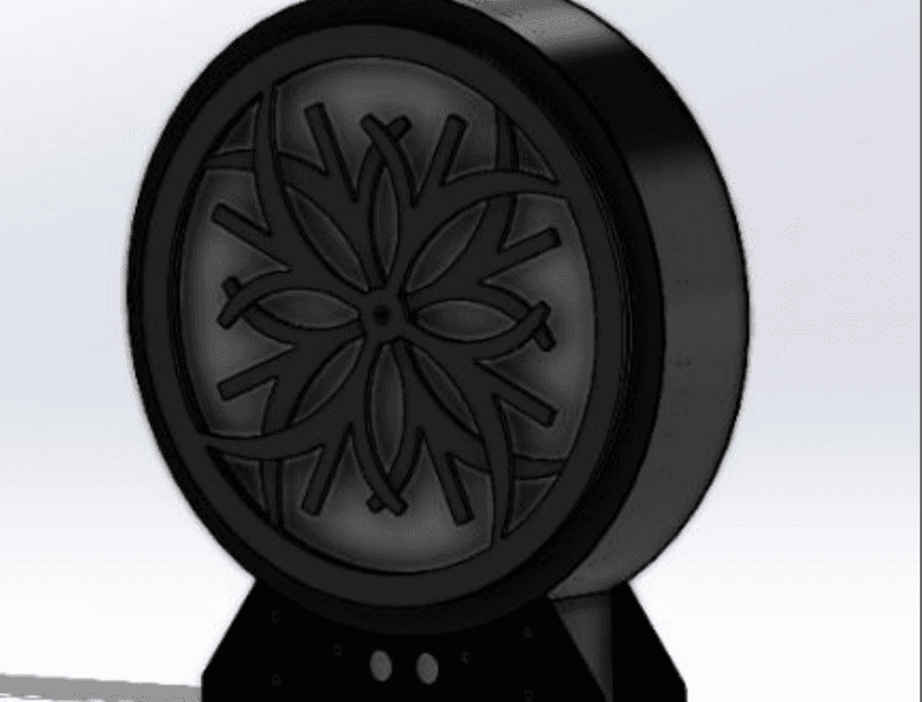 SolidWorks render of the kinetic sculpture: a black circular enclosure framing the moiré disk pattern, standing on a black base with two round openings.
